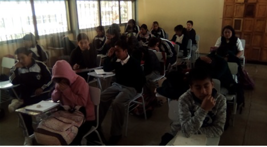 Teens in crowded rural classroom Mexico