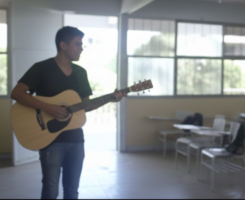 Teen in classroom playing guitar